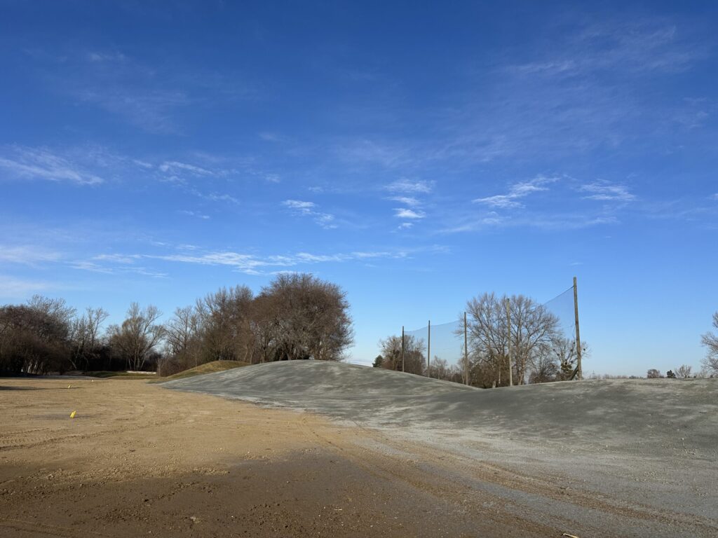 Revegetation of a shaped bund on a golf course