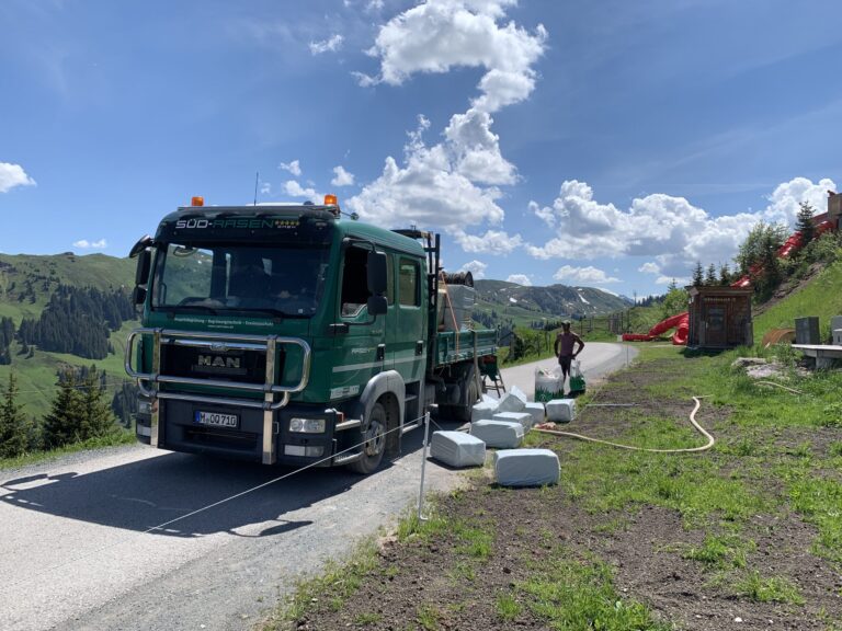 Service vehicle and mulch bales at a high-altitude revegetation site