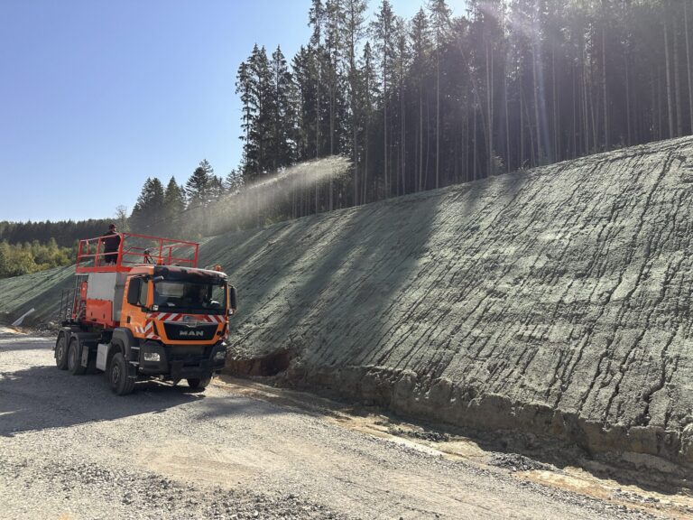 Slope revegetation by hydraulically applied seeding