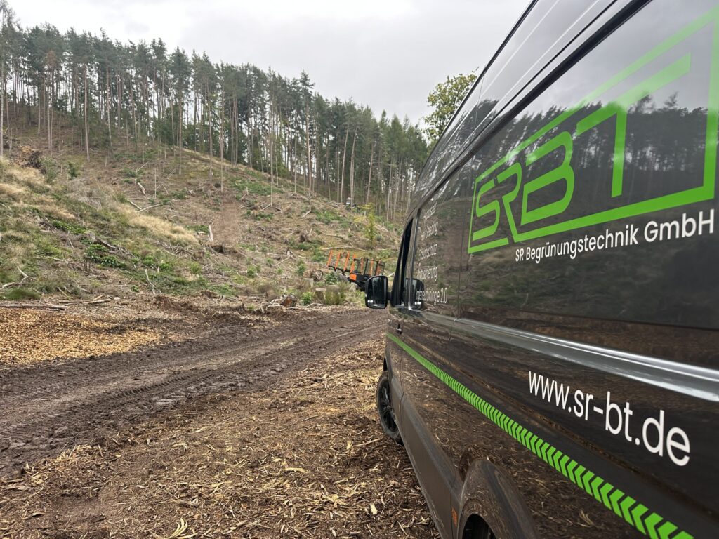 SRBT service van on a forest track beside a clear-felled slope